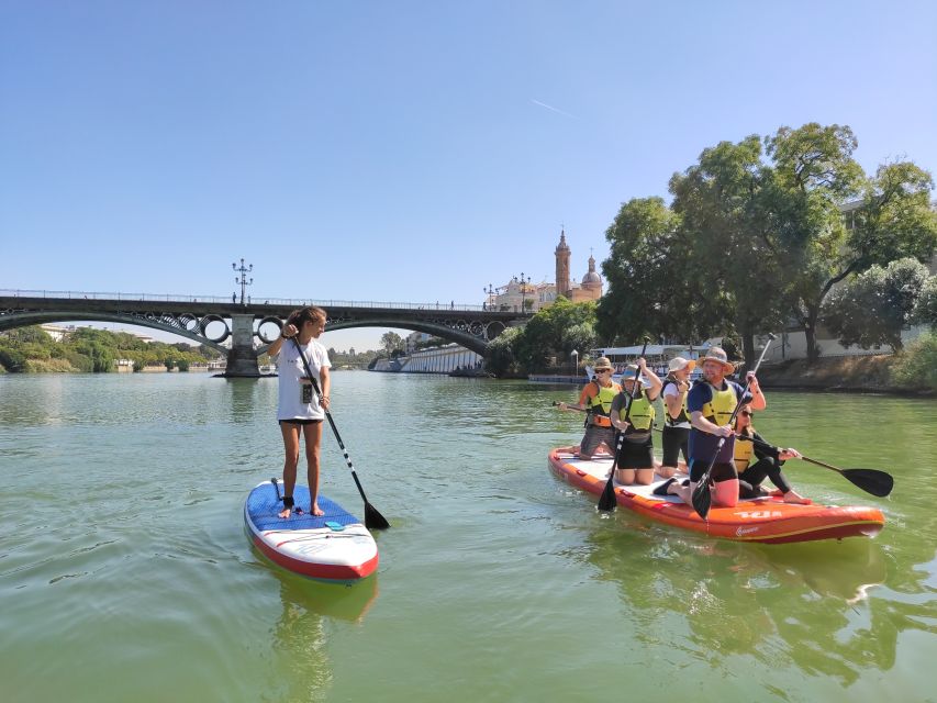 1 seville group giant paddle boarding session Seville: Group Giant Paddle-Boarding Session
