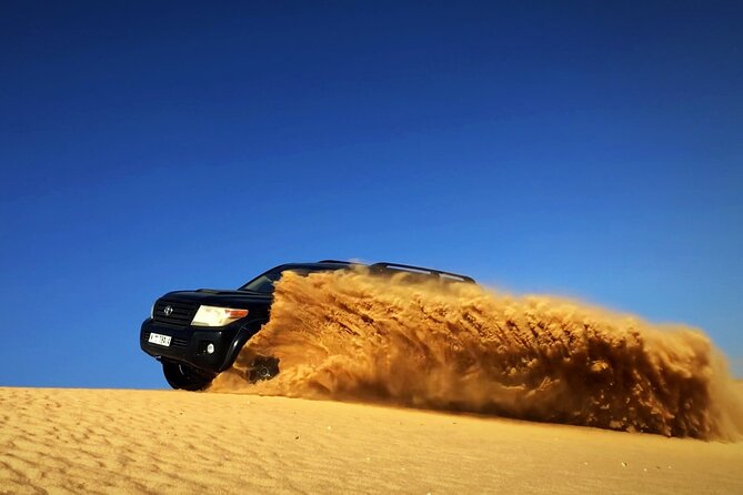 Desert Safari Dubai With BBQ - Dinner, Sandboarding - Indulge in Sandboarding Thrills