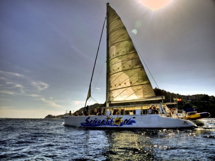 Lloret De Mar: Sunset Catamaran Cruise With DJ and Drinks - Experience Highlights