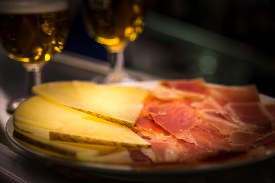 Madrid: Authentic Tapas Evening Tour With a Side of History - Meeting Point and Inclusions