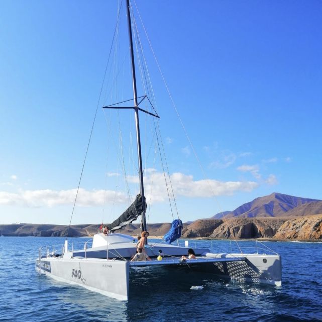 Playa Blanca: Private Catamaran Tour With SUP and Snorkeling - Private Group Setting and Meeting Point