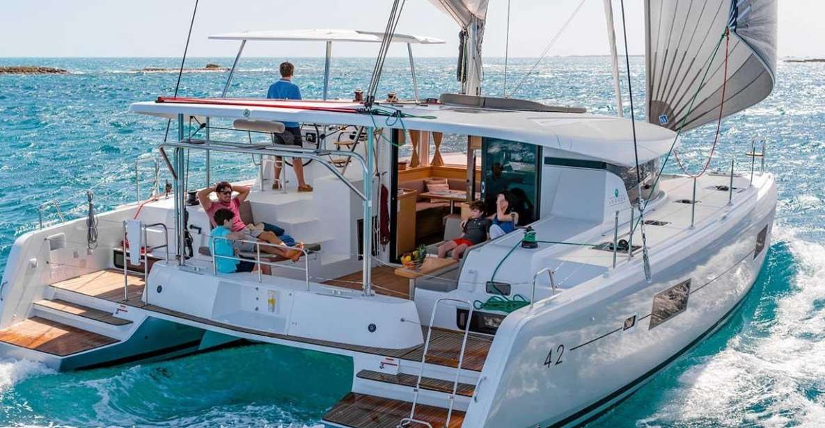 Santorini: Private Luxury Catamaran Cruise With Greek Meal - Explore Santorinis Stunning Coastline