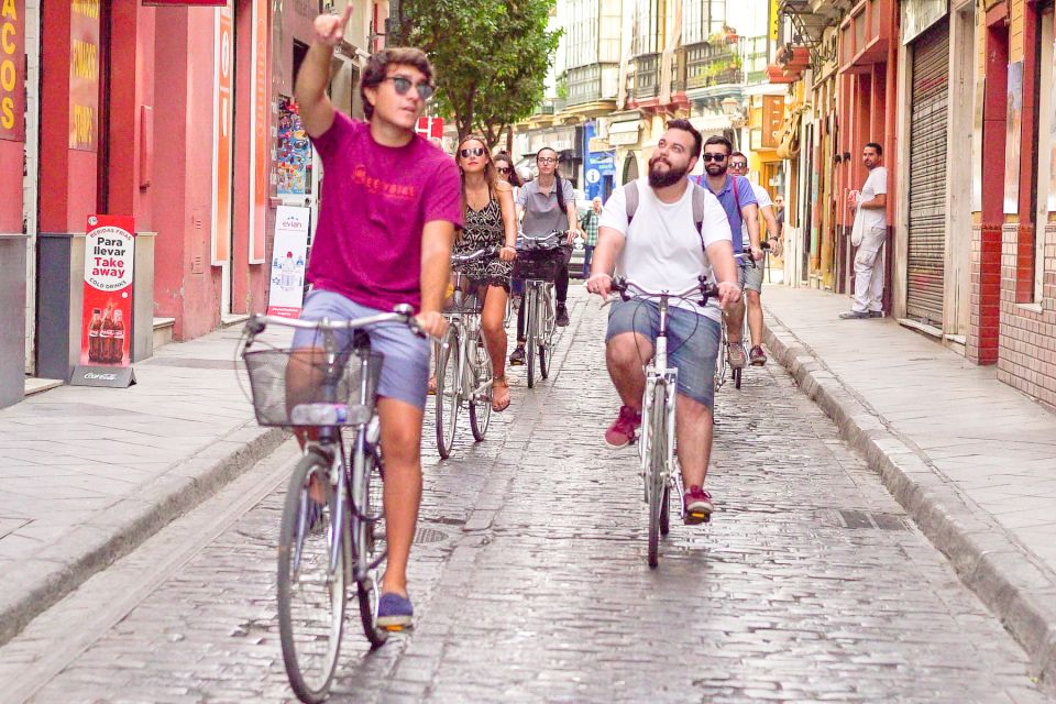 Seville: City Sightseeing and Local Culture Bike Tour - Cancellation Policy and Booking Options