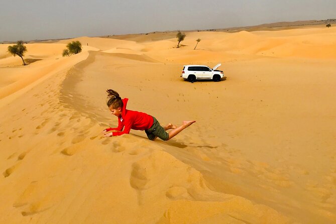 Abu Dhabi Morning Desert Safari,Dune Bashing,Sandboarding,Camel Riding&Quad Bike - Memorable Camel Riding Encounter