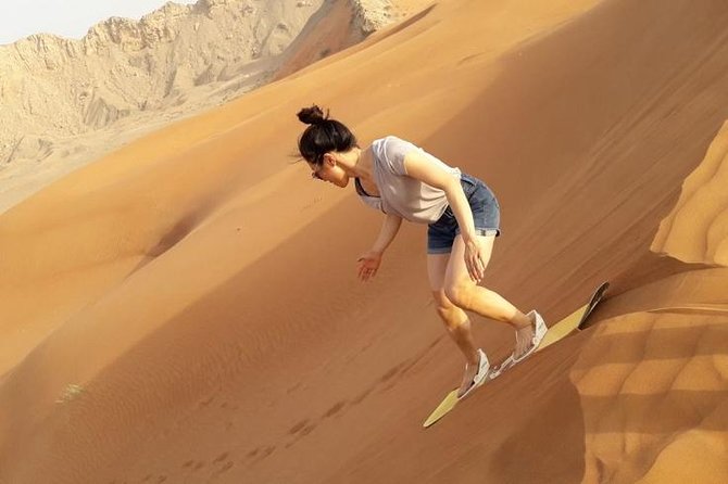 Camel Rock Desert Safari Dubai With Bbq Dinner Camel Ride Sand Boarding & More - Cancellation Policy