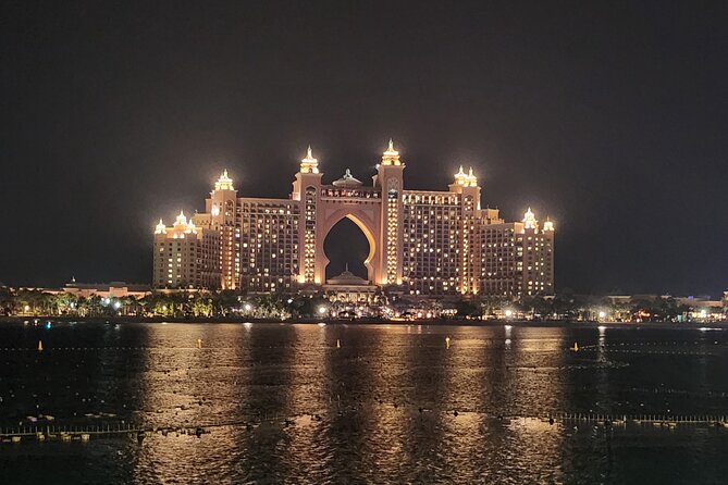 Dubai After Dark City Highlights With Dinner, Guide and Transfer - Booking and Reservations