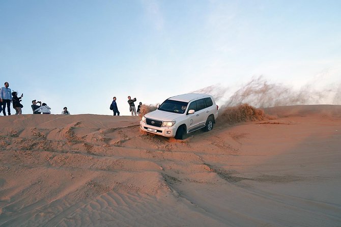 Exclusive Sunrise Desert Safari With Camel Ride Sand Boarding Dune Bashing - Support Services Available