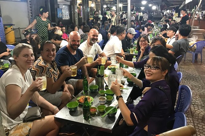 The Unique Ao Dai Street Food Tour By Scooter - Landmarks and Markets