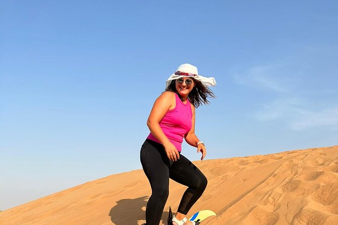 Dubai Sunset Red Dune Safari: Camel Ride, Sandboarding & BBQ - Key Points