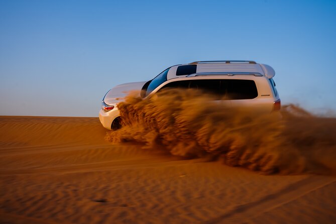 Evening Desert Safari With Camel Ride & Sandboarding - Key Points