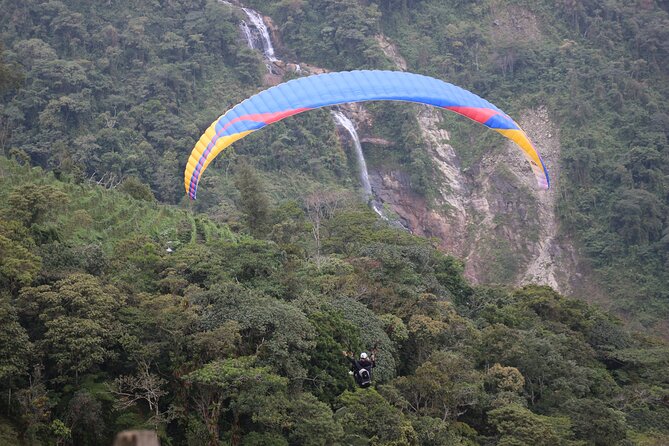 Paragliding Flight Over a Valley of Mountains and Waterfalls Video - Key Points