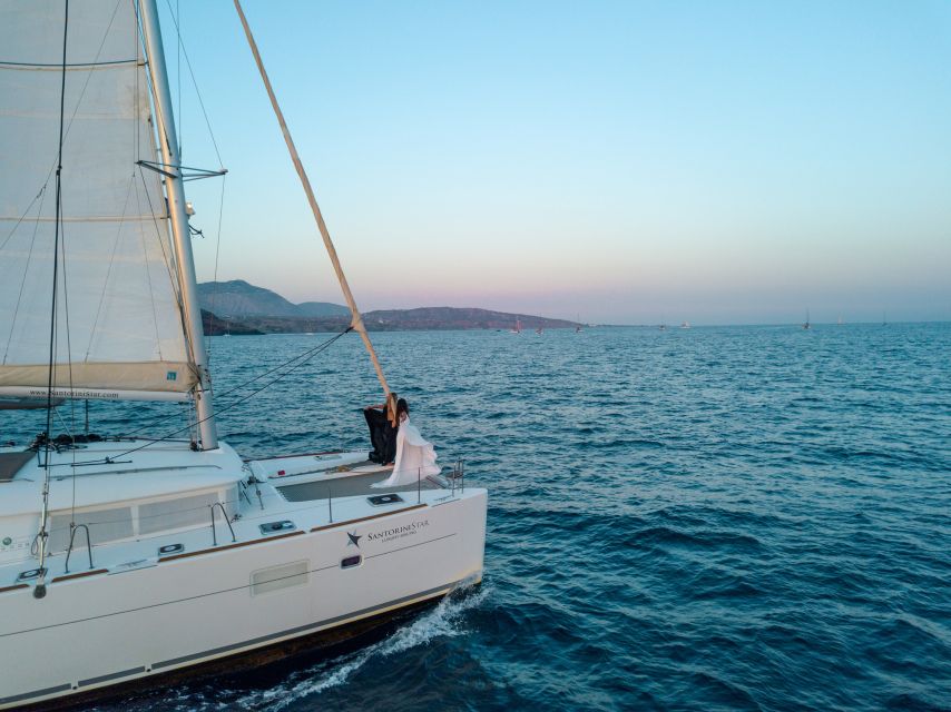 Santorini Catamaran Cruise With Swimming, Meal and Open Bar - Key Points