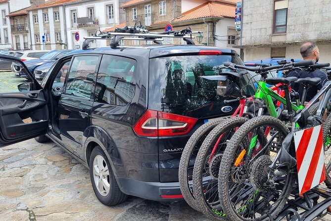 Taxi Bikes Transporting Bicycles and Cyclists From Santiago to Porto - Key Points