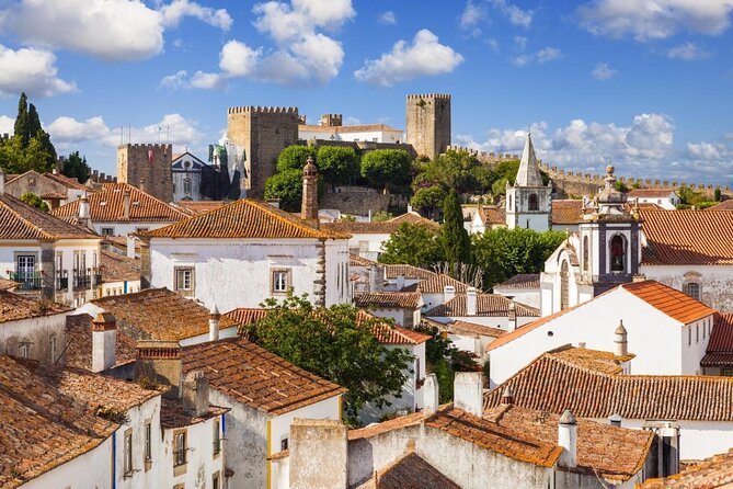 Transfer From Lisbon to Coimbra, Visiting Óbidos, Alcobaça, Batalha, and Tomar - Key Points