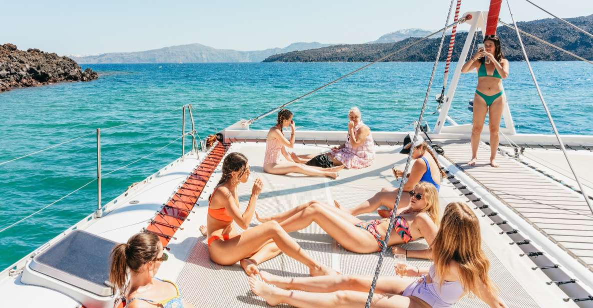 1 santorini catamaran tour with bbq dinner drinks and music Santorini: Catamaran Tour With BBQ Dinner, Drinks, and Music