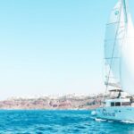 1 santorini catamaran tour with bbq meal and unlimited drinks Santorini: Catamaran Tour With BBQ Meal and Unlimited Drinks