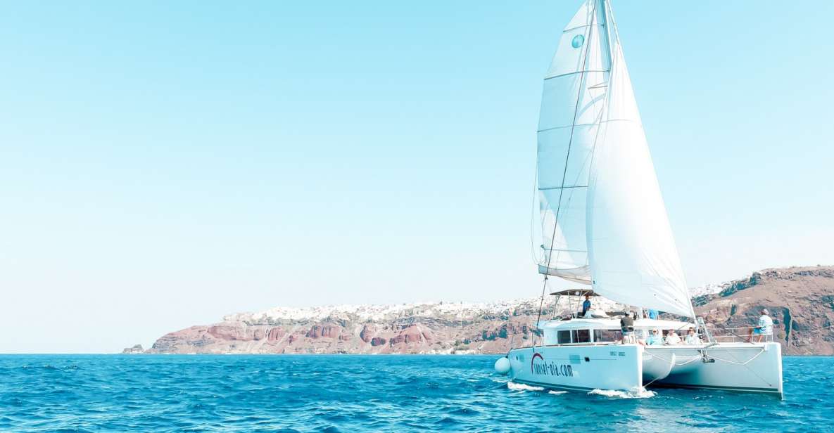 1 santorini catamaran tour with bbq meal and unlimited drinks Santorini: Catamaran Tour With BBQ Meal and Unlimited Drinks