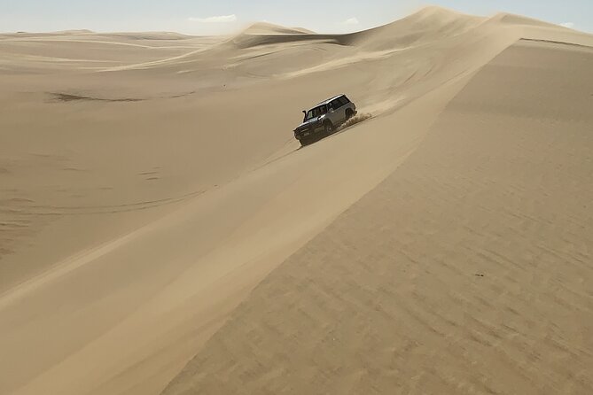 From Siwa: Sunset Desert Safari, Sand-board, Hot Spring & Dinner at Desert Camp - Relaxation at the Natural Hot Spring
