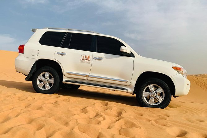 Morning Dubai Red Dunes Safari With Camel Ride & Sand Boarding - Sandboarding on Golden Dunes