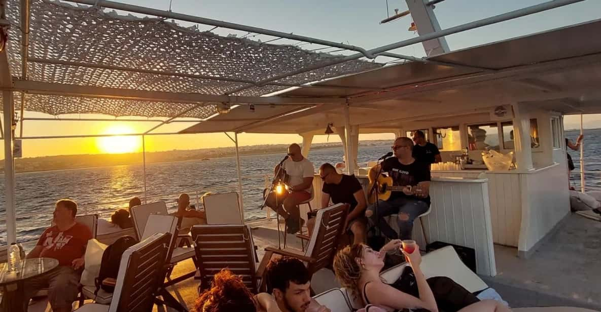 Rhodes: Sunset Cruise With Live Music, Wine & Greek Buffet - Onboard Experience