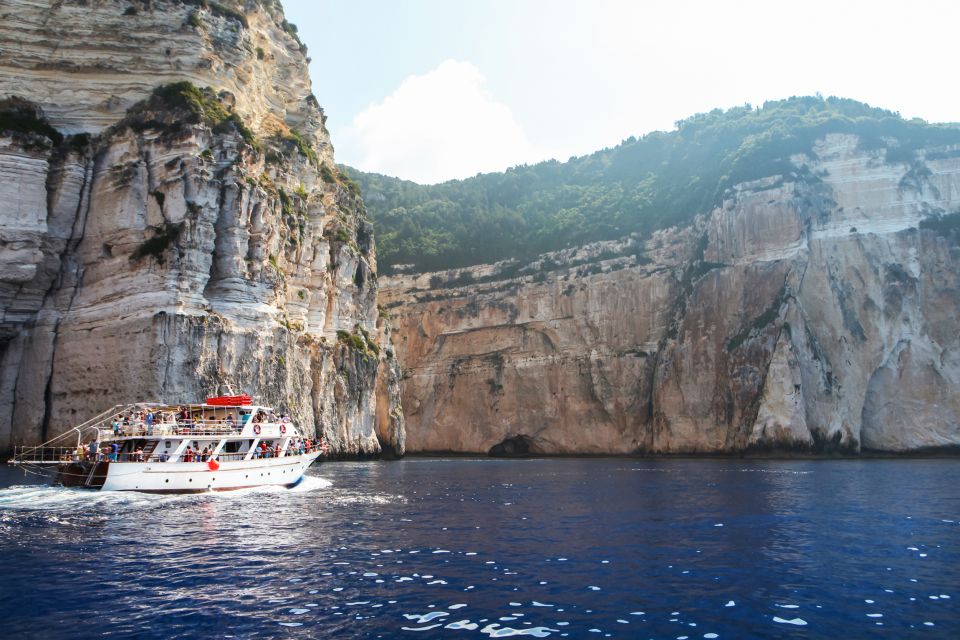 From Corfu: Day Cruise to Paxos, Antipaxos, & the Blue Caves - Language Options and Pickup