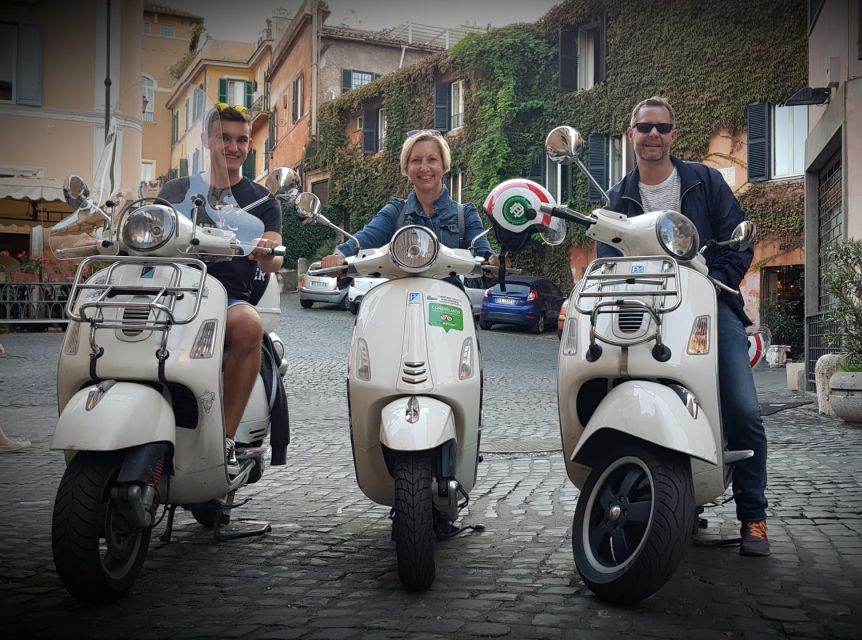 Rome: Colosseum and Pyramid of Cestius Vespa Tour in German - Key Points